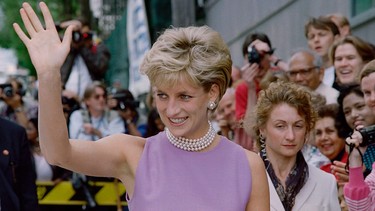 Diana, Princess of Wales, waves to the public as she leaves the Victor Chang Cardiac Research Institute in Sydney on Nov. 1, 1996.