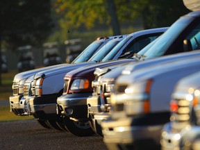 A parking lot full of trucks and SUVs