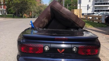 Peel police stop convertible carrying armchair.