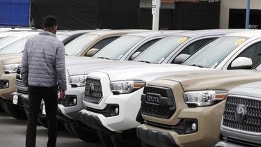 A salesman views used Toyota Motor Corp. vehicles at the Brent Brown Toyota dealership in Orem, Utah, U.S. in April 2020.