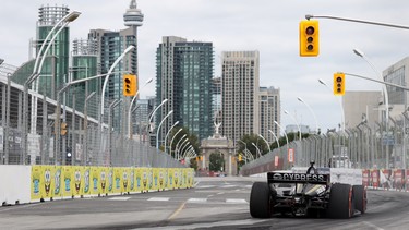 James Hinchcliffe speeds by the Toronto cityscape.