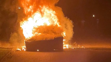Tesla's new Model S Plaid electric car is seen in flames in Pennsylvania, U.S., in this handout photo provided to Reuters on July 2, 2021.