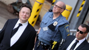 Tesla CEO Elon Musk departs after taking the stand to defend Tesla's 2016 deal for SolarCity in a case before the Delaware Court of Chancery in Wilmington, Delaware, U.S. July 12, 2021.