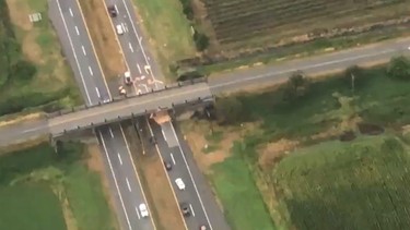 B.C. truck transporting a shed collides with overpass, causes delays