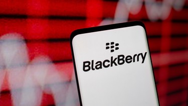 The Blackberry logo is seen on a smarphone in front of a displayed stock graph in this illustration taken February 5, 2021.