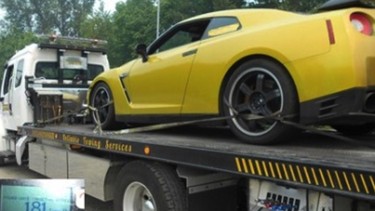 An impounded Nissan GT-R on the back of a tow truck in B.C.