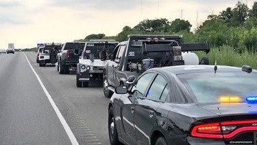 Tow trucks stopped for street racing