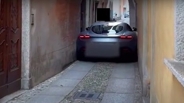 A Ferrari Roma stuck in an alleyway in Italy in August 2021