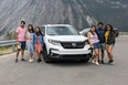 Nitin Garg (middle right) of Toronto picked up this 2021 Honda Pilot Black Edition with his wife Tanvi Kalra (leaning against driver side front fender) and four other family members and drove as far as Hinton, Alberta in the seven-passenger SUV. There was plenty of room for all passengers and luggage, which impressed Garg.