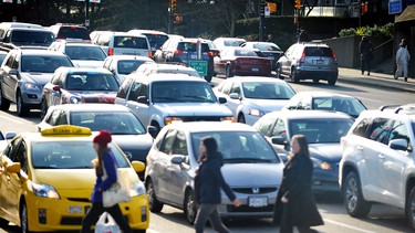 Traffic and people congestion clogs the intersection of West Broadway and Cambie in    Vancouver on January 20, 2015.