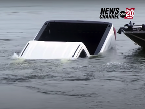 WATCH- News reporter accidentally catches GMC Sierra sinking into a lake live on TV