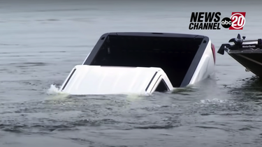 WATCH- News reporter accidentally catches GMC Sierra sinking into a lake live on TV