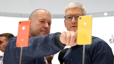 Apple chief design officer Jony Ive (left) and Apple CEO Tim Cook inspect the new iPhone XR during an Apple special event at the Steve Jobs Theatre on September 12, 2018 in Cupertino, California.