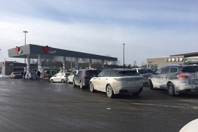 A lineup of cars waiting for gas at the Mallorytown (East) ONroute on January 1, 2018.