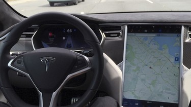The interior of a Tesla Model S is shown in Autopilot mode in San Francisco, California, U.S., April 7, 2016.