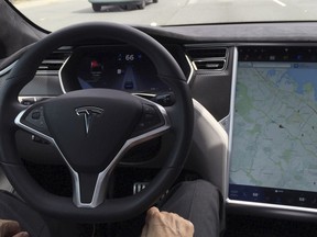 The interior of a Tesla Model S is shown in Autopilot mode in San Francisco, California, U.S., April 7, 2016.