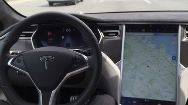 The interior of a Tesla Model S is shown in Autopilot mode in San Francisco, California, U.S., April 7, 2016