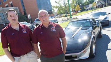 Gary McGuinness, left, and Moe Dupuis, right, members of the Corvette Club of Windsor, stand with their Corvettes outside Windsor Regional Hospital Met campus after making a $5,500 donation to support paediatric oncology on Tuesday, Sept. 28, 2021.
