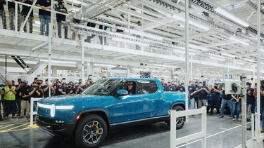 The first production Rivian R1T electric pickup rolling off the assembly line