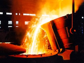 A large bowl of molten metal at a steel mill.