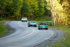 Matt Bartlett, in his 1973 MGB, and Hilary Riem, in her father Justin's 1966 Ford Mustang, tail Nicholas Maronese's 1971 Plymouth Scamp on the 2024 Maple Mille car rally