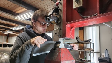 David Ryan at work on a Pullmax metal shaping machine to create a panel for the Cord Aerospace he’s constructing by hand.