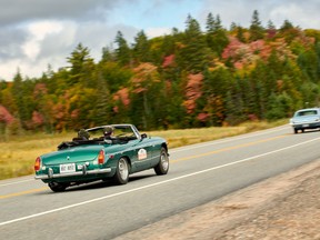 Matt Bartlett in his 1973 MGB, and Hilary Riem in her father Justin's 1966 Ford Mustang