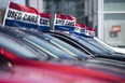 A row of used cars at a dealership