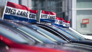 A row of used cars at a dealership