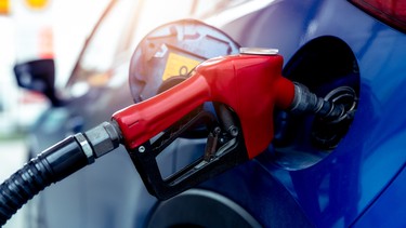 A close-up of a pump nozzle at a gas station