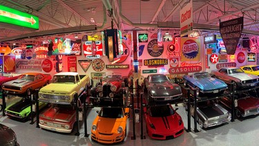 The Amazing collection of historic signs form the backdrop for classic cars displayed in the neon mancave built by friend Jeff Budnick and Danny Amoroso.