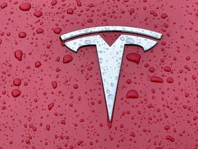 The Tesla badge on a Model 3