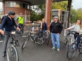 VW CEO Herbert Diess, left, on October 6 tweeted this picture of himself with German bicylists.