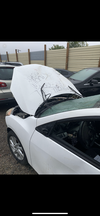 Ashley Hogan's Mazda3 sits at a junkyard after being bashed and tipped over at a fake McMaster University homecoming party where 5,000 students took over a residential street in Hamilton.