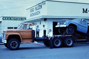 The Friesen brothers with a load of 1963 Ford trucks being delivered to their father’s dealership.