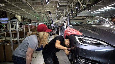 Laurie Shelby, vice president of environmental, health and safety at Tesla, talks with an employee on March 20, 2018 in Fremont, California.  Shelby is responsible to implement the new safety rules required by Alameda County at the auto plant.  (Photo by Paul Kuroda/Sipa USA)No Use UK. No Use Germany.
