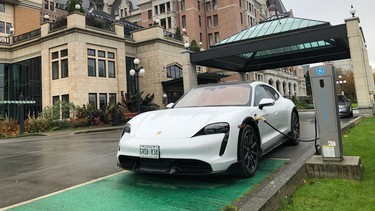 The future meets the past as the 2021 Porsche Taycan Cross Turismo charges up in the driveway of the iconic Fairmont Empress Hotel overlooking Victoria's Inner Harbour.