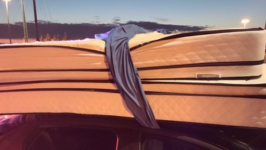 Passengers were allegedly holding the mattress to the roof with a bedsheet