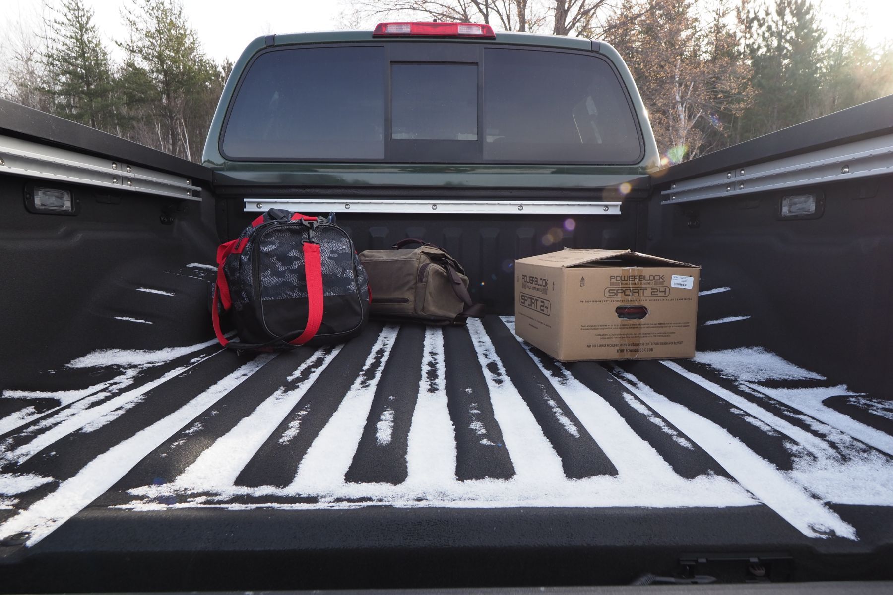 Transport a pet in the bed of an 2024 open pickup truck