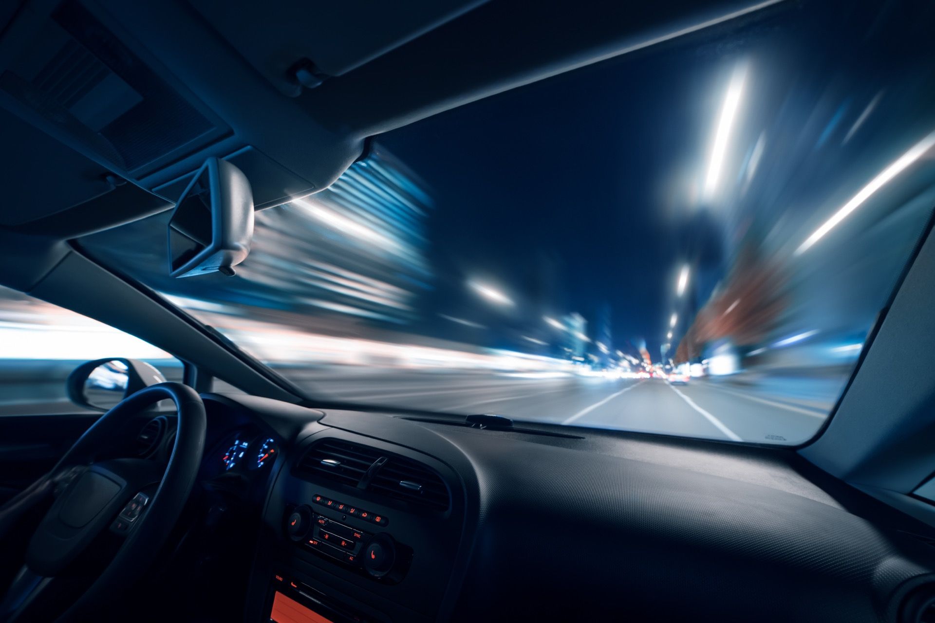 A car driving at high speed at night