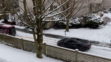 McLaren 570S towed up a snowy Vancouver driveway