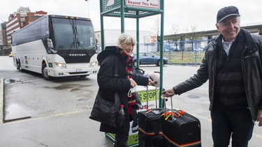 Don and Peggy Cunningham at the Pacific Central Station in Vancouver on Wednesday. The pair had just disembarked from an Ebus from Kelowna, one of the first buses to traverse the Coquihalla since it reopened to commercial traffic on Tuesday.