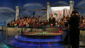 Host Pat Sajak performs with NFL players during taping of the NFL Players Week 10th Anniversary on Wheel Of Fortune on December 6, 2005 in Fort Lauderdale, Florida.