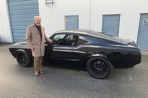 Vancouver collector car dealer Wayne Darby with a hot Mustang – one of the 42 classics he sent to the Barrett-Jackson Auction in Scottsdale, Arizona.