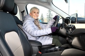 Fay behind the wheel of the Escape PHEV.