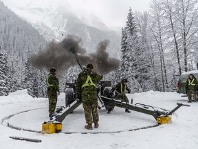 Gunners from the 1st Regiment, Royal Canadian Horse Artillery fire a 105mm C3 Howitzer gun as part of Operation Palaci to clear snow pack in danger of avalanche at Rogers Pass, British Columbia, Canada November 22, 2018. Picture taken November 22, 2018.