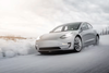A Tesla Model 3 in the snow