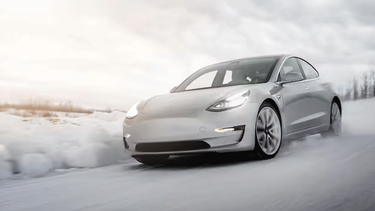 A Tesla Model 3 in the snow