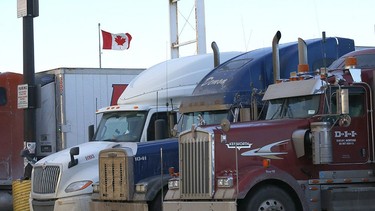 Transport trucks parked at the Roadking Travel Centre in Calgary as vaccine mandates at the U.S. border could worsen supply chains. Photo taken on Tuesday, January 11, 2022.