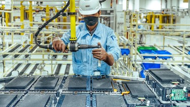 A worker assembles a battery on a VinFast production line in Hai Phong City, Vietnam.